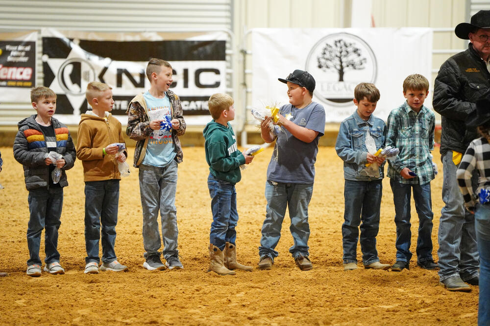 Young boys dressed in western attire awaiting judging for the best dressed contest