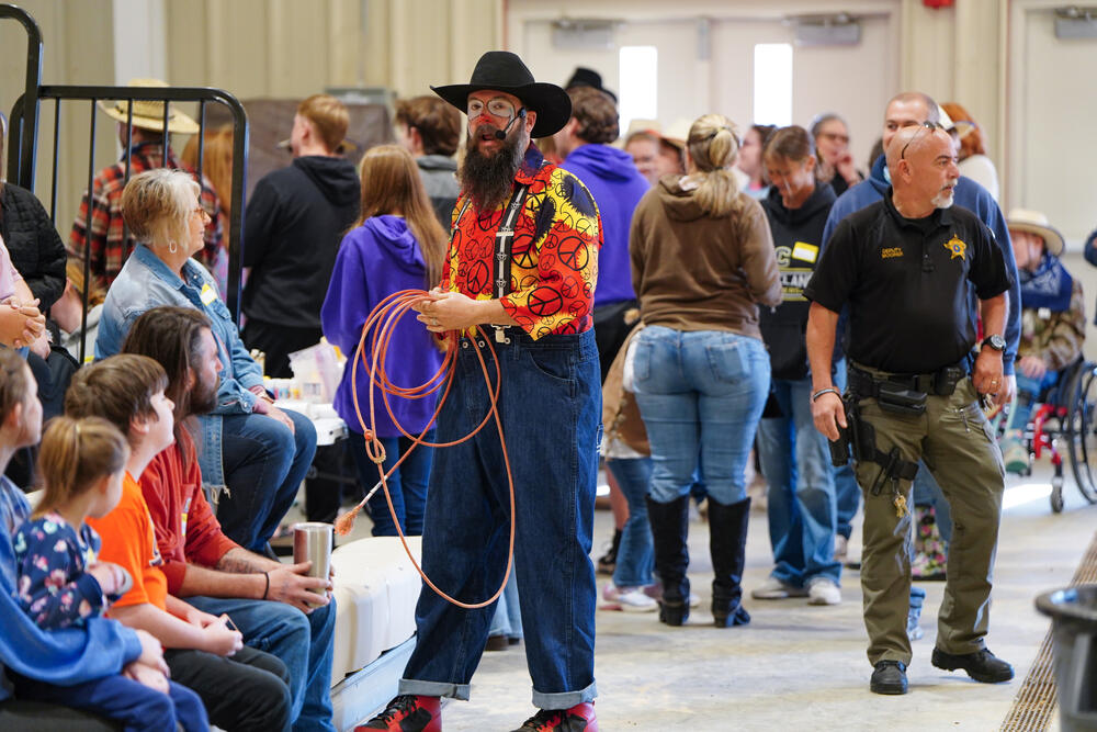 Rodeo clown interacting with kids in the stands at the exceptional needs rodeo. 